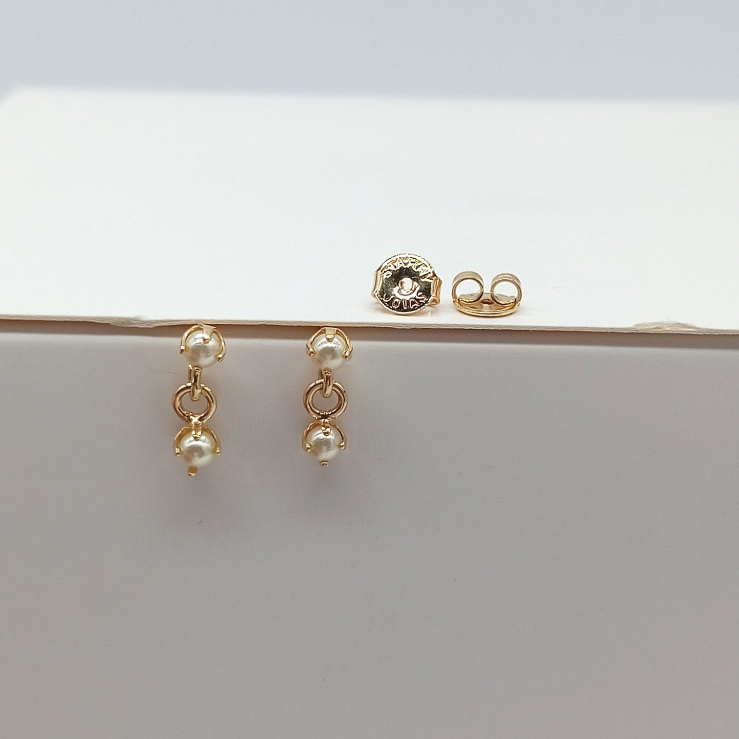 Arete colgante perlado